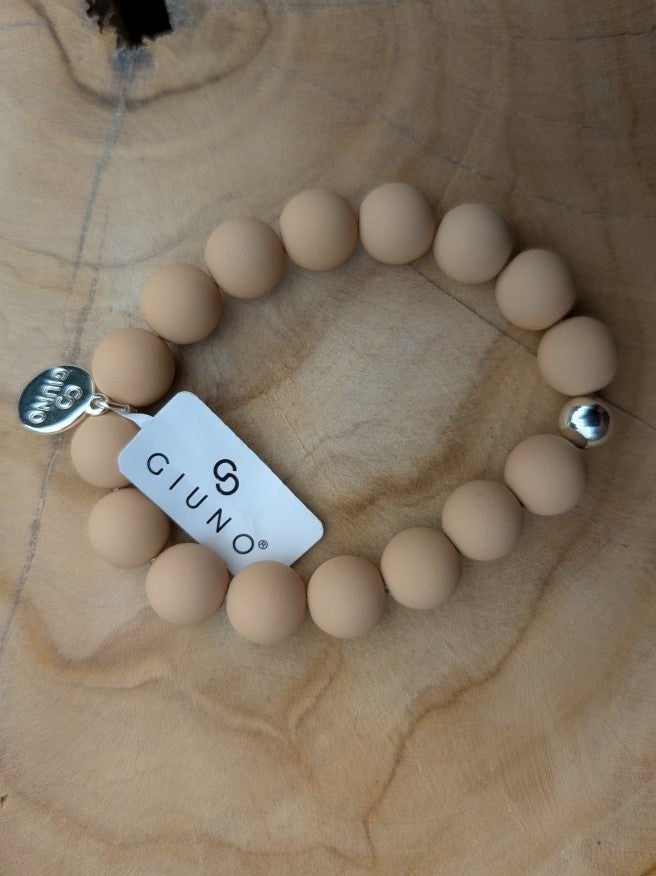 Zeigen Sie Ihre Persönlichkeit mit unserem großartigen elastischem Armband mit mittelgroßen Perlen aus Acryl und Kupfer in warmen Beige - holen Sie es sich jetzt!