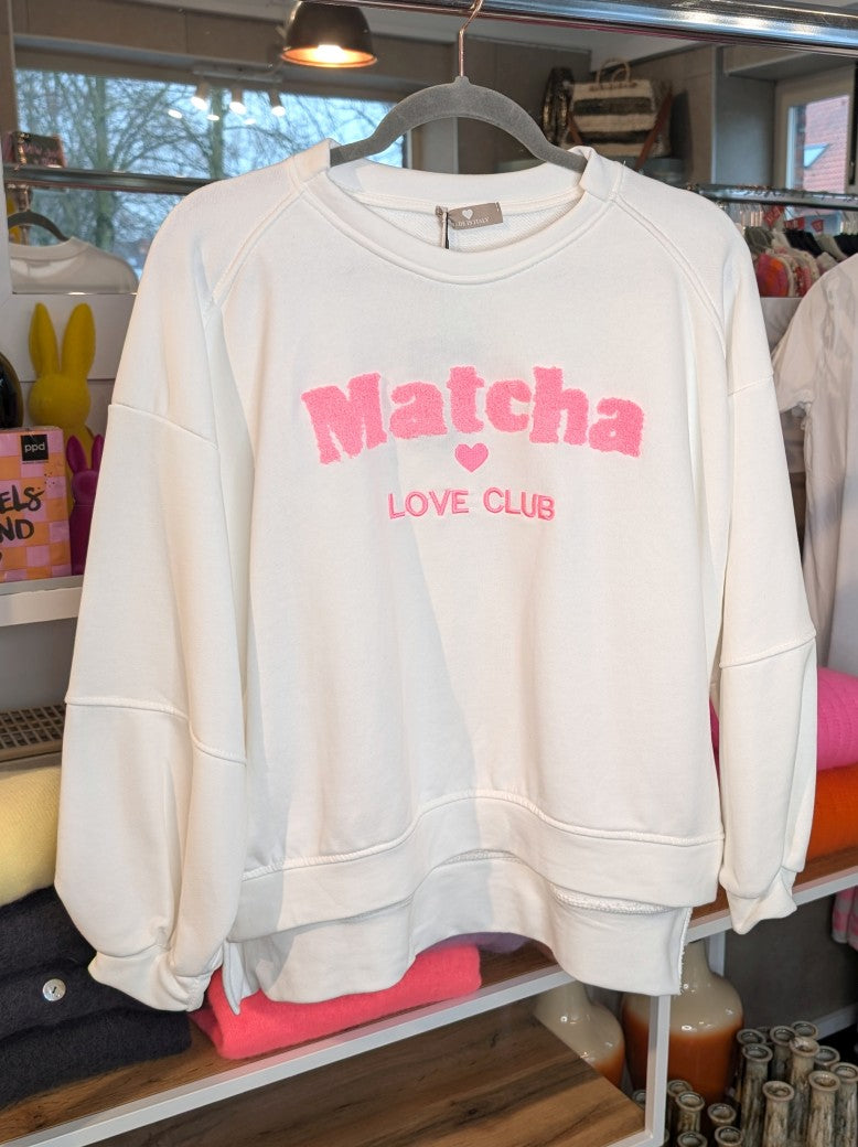 Das hochwertige Baumwoll-Sweatshirt Matcha Love Club besticht durch seine harmonische Farbgestaltung in trendigem Créme und Hellrosa - dein perfekten Begleiter!