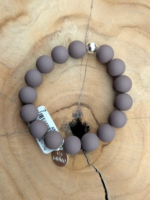 Zeigen Sie Ihre Persönlichkeit mit unserem großartigen elastischem Armband mit mittelgroßen Perlen aus Acryl und Kupfer in Dark Taupe - holen Sie es sich jetzt!