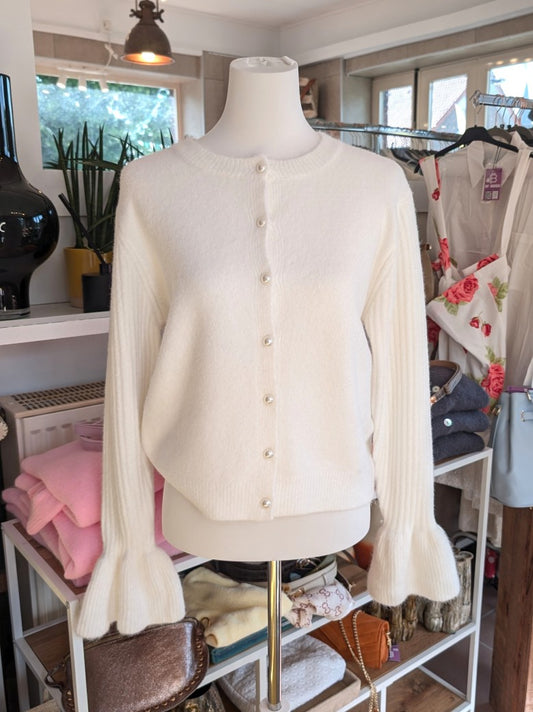 Elegante Viskose Strickjacke in Woll Weiß mit charakteristischen Ballonärmeln und zarten Perlenknöpfen. Moderner femininer Look von Casual bis Business!