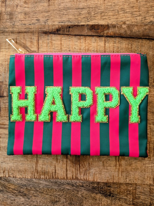 Die Make-Up- und Kosmetiktasche vereint praktische Funktionalität mit fröhlichem Design in gestreiftem Muster Rot Grün mit "HAPPY" in Grün mit Goldrand!