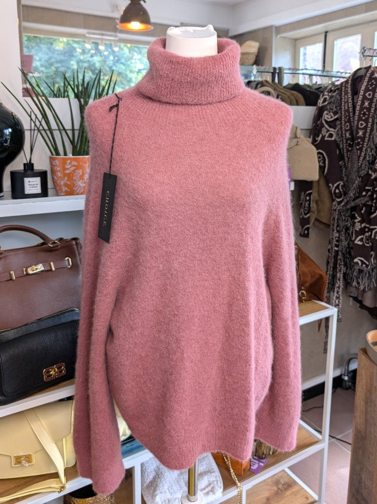 Der luxuriös samtweiche rosa Rollkragenpullover verbindet zeitlose Eleganz mit unvergleichlichem Tragekomfort – perfekt für gemütliche Herbst- und Wintertage!