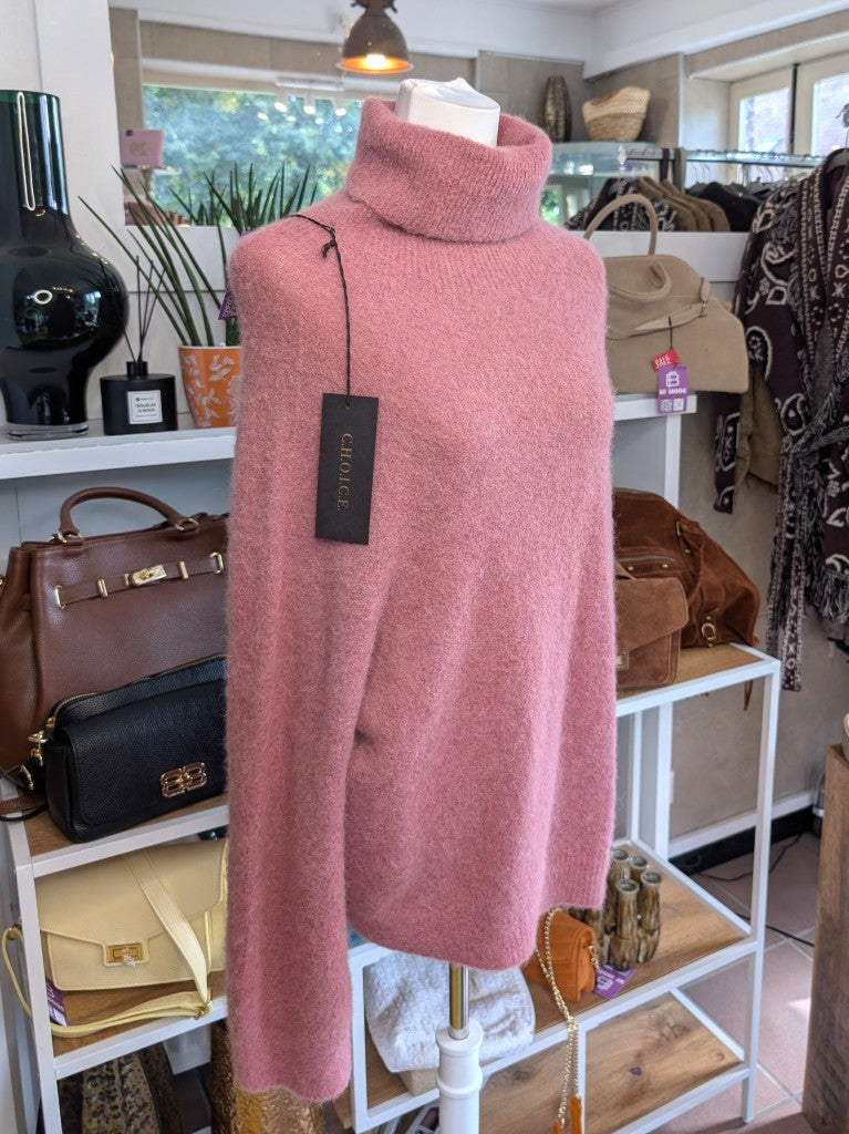 Der luxuriös samtweiche rosa Rollkragenpullover verbindet zeitlose Eleganz mit unvergleichlichem Tragekomfort – perfekt für gemütliche Herbst- und Wintertage!