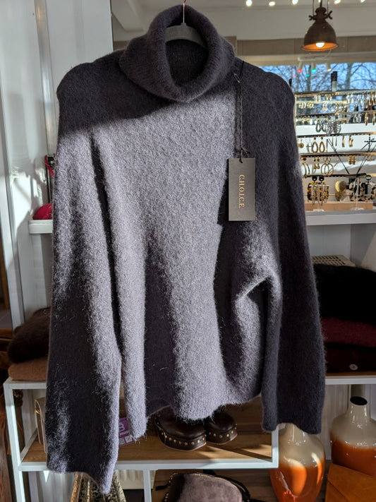 Der luxuriös samtweiche Anthrazit Rollkragenpullover verbindet zeitlose Eleganz mit unvergleichlichem Tragekomfort – perfekt für gemütliche Herbst-/ Wintertage!
