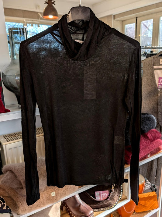 Das Langarm Shirt aus zarten Kaschmir mit hauchdünnem Stoff und Rollkragen aus hochwertiger Viskose in elegantem Schwarz - für stilbewusste Looks mit Raffinesse!