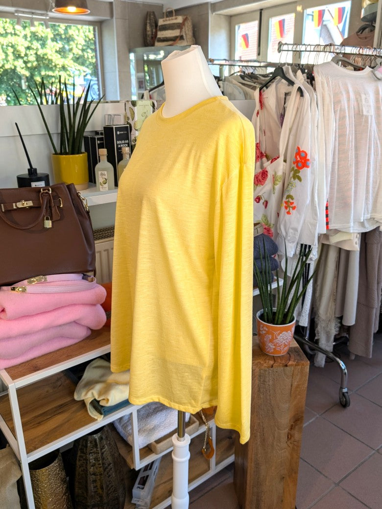 Verleihe Deinem Outfit mit diesem Shirt in Butter Yellow Gelb einen Hauch von Transparenz. Einzigartiger Look mit dem langärmligen halbtransparente Design!