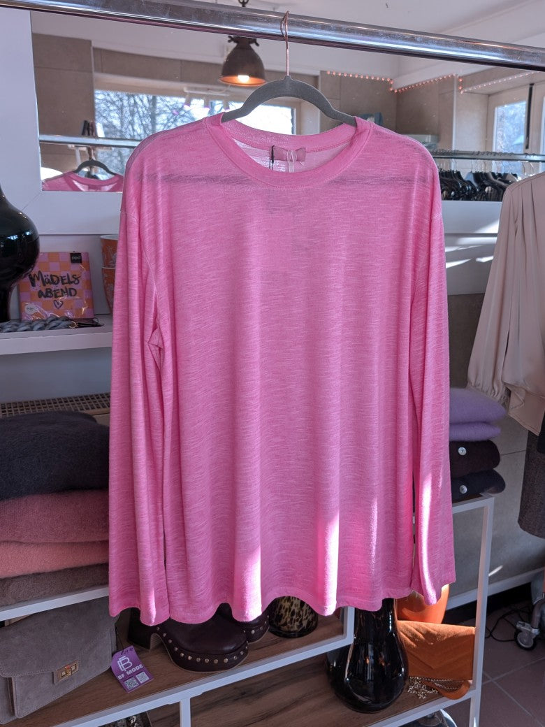 Verleihe Deinem Outfit mit diesem Shirt in Pink einen Hauch von Transparenz. Das langärmlige und halbtransparente Design verleiht einen einzigartigen Look!