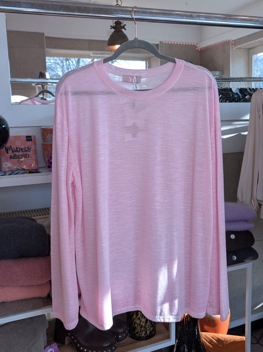 Verleihe Deinem Outfit mit diesem Shirt in Rosa einen Hauch von Transparenz. Das langärmlige und halbtransparente Design verleiht einen einzigartigen Look!