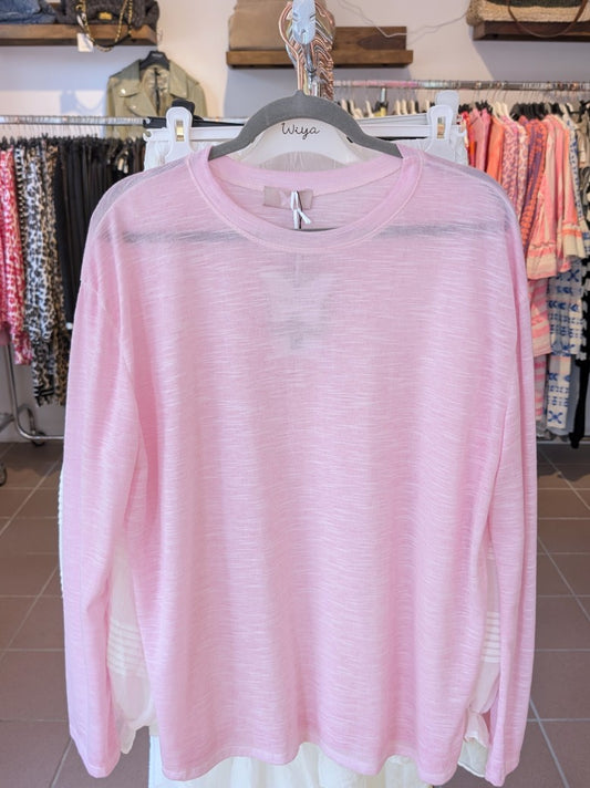 Verleihe Deinem Outfit mit diesem Shirt in Rosa einen Hauch von Transparenz. Das langärmlige und halbtransparente Design verleiht einen einzigartigen Look!