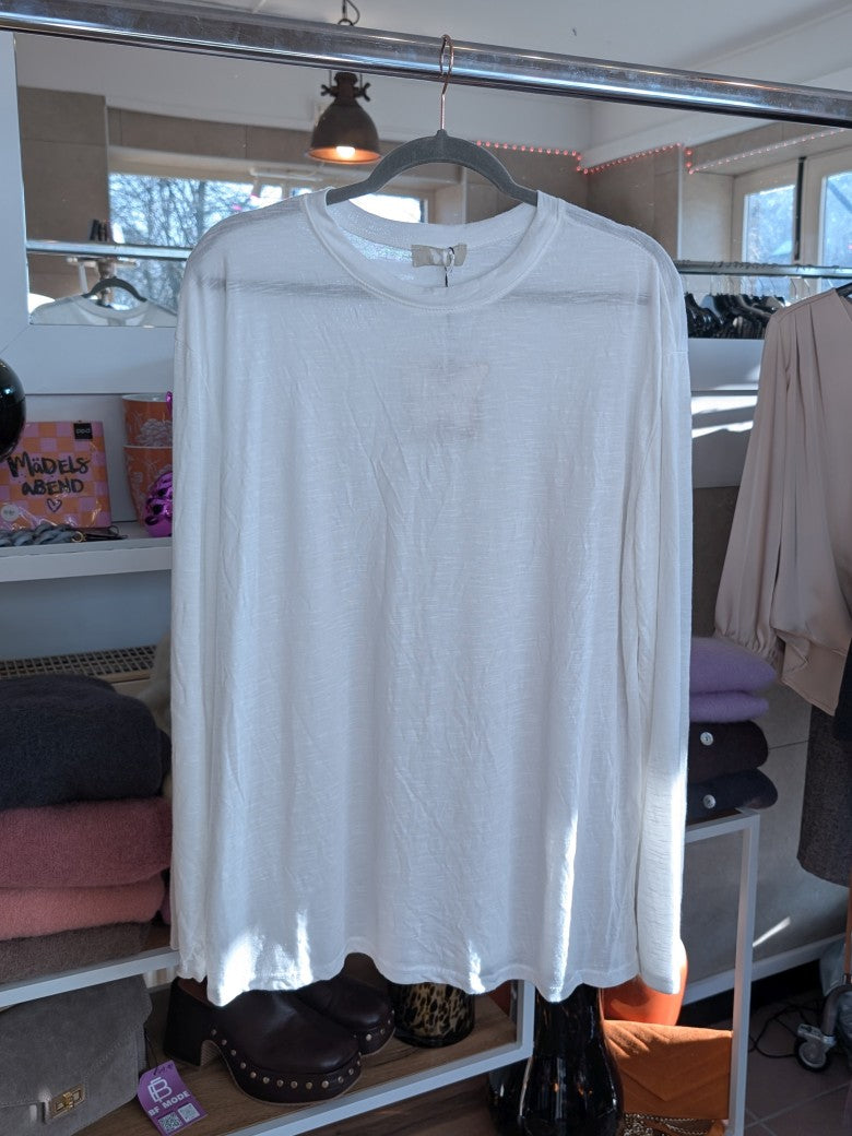 Verleihe Deinem Outfit mit diesem Shirt in Weiß einen Hauch von Transparenz. Das langärmlige und halbtransparente Design verleiht einen einzigartigen Look!