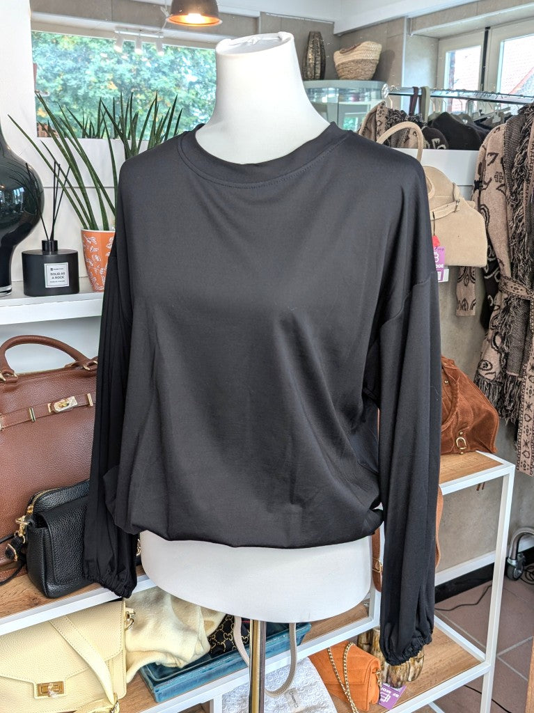 Gemütliches Cropped Langarm Shirt Sweatshirt aus weicher Viskose in klassichem Schwarz mit Gummizug am Saum.
