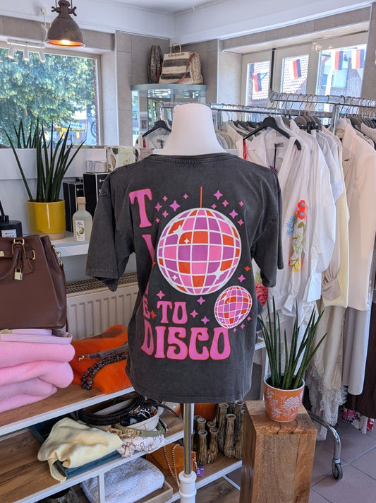 Das Anthrazit T-Shirt mit lebendigem Backprint in Pink, Orange und Flieder bringt Disco-Feeling in deinen Alltag - perfekt für farbenfrohe trendiges Outfit!
